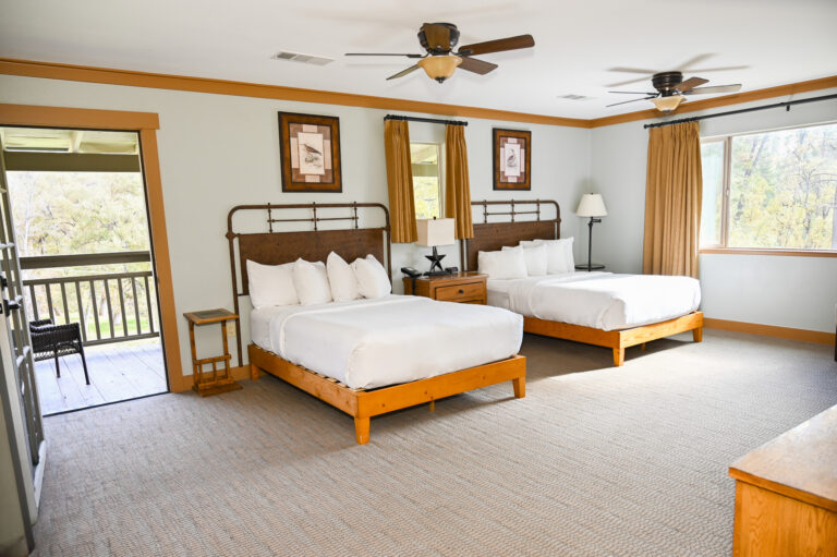 ADA accessible Guest House room with two full beds and warm pine furnishings at Sierra Sky Ranch near Yosemite National Park