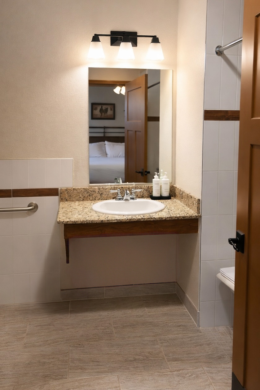 ADA accessible bathroom with roll-in shower in Guest House king room at Sierra Sky Ranch boutique hotel near Yosemite National Park