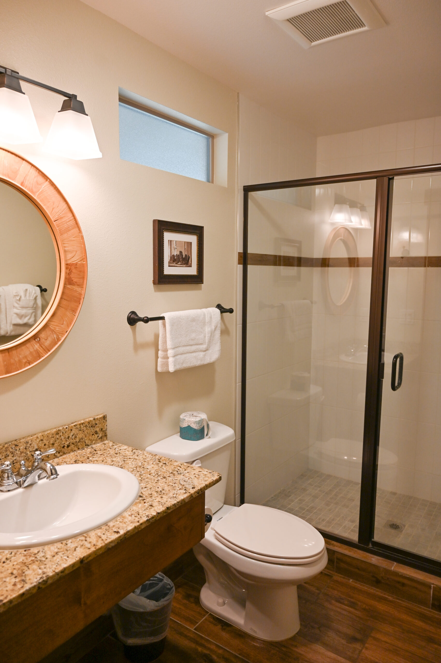 Walk-in shower bathroom with modern fixtures in Guest House king room at Sierra Sky Ranch boutique hotel near Yosemite National Park