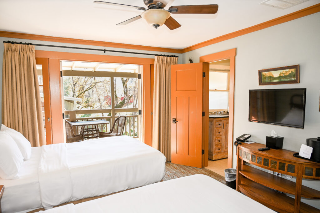 Ranch House double bed room with two full beds and Old West decor at Sierra Sky Ranch boutique hotel near Yosemite South Entrance Oakhurst CA
