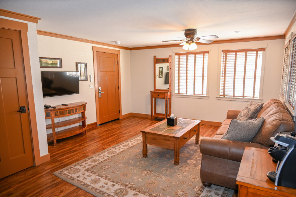 Comfortable sitting area with sofa bed in Ranch House queen suite at Sierra Sky Ranch boutique hotel near Yosemite South Entrance