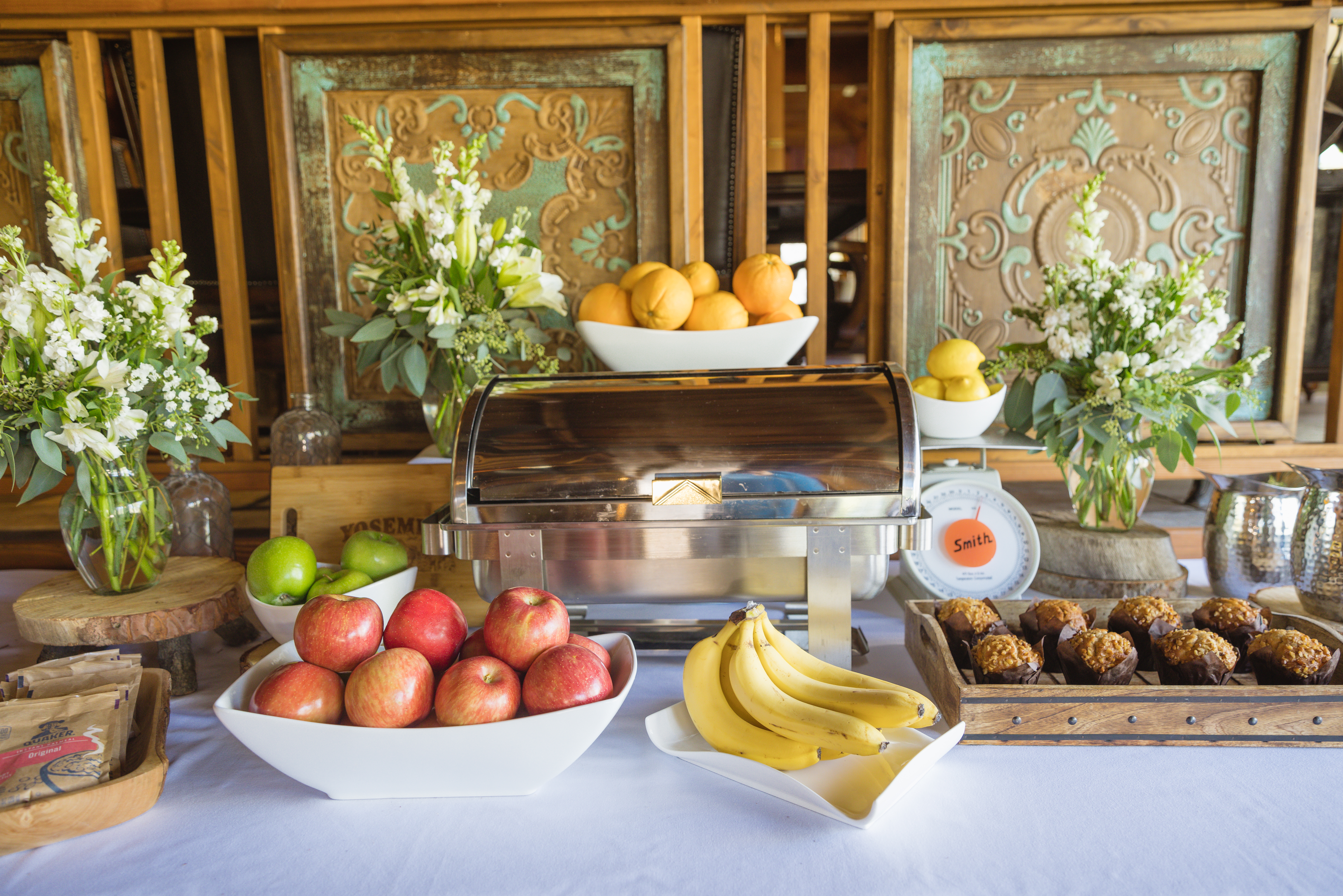 A continental breakfast of fruit, pastries, and coffee laid out at Sierra Sky Ranch.