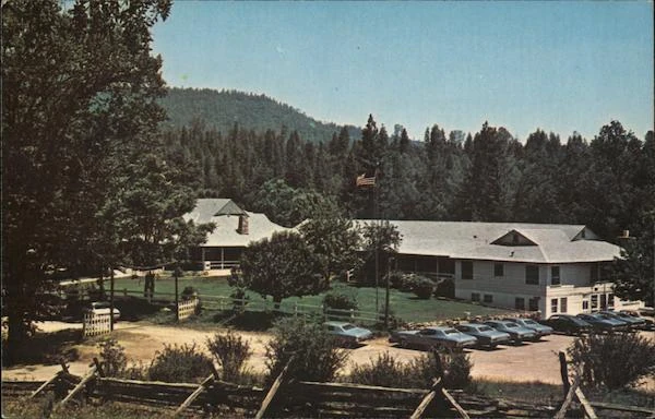 Historic vintage postcard of Sierra Sky Ranch lodge and grounds circa 1970.